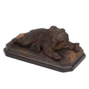 cast iron sculpture of a lying Russian bear attributed to Nikolai Lieberich on wooden base