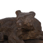 cast iron sculpture of a lying Russian bear attributed to Nikolai Lieberich on wooden base