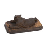cast iron sculpture of a lying Russian bear attributed to Nikolai Lieberich on wooden base
